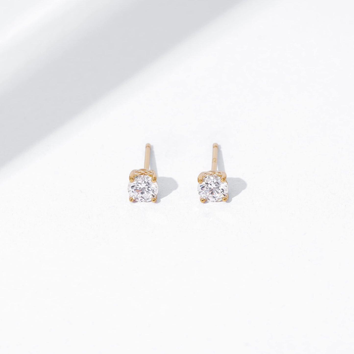 Amazon Essentials Yellow Gold Plated, Platinum or Rose Gold Plated Sterling Silver Infinite Elements Cubic Zirconia Stud Earrings | White, Blue, Green, or Pink Cubic Zirconia