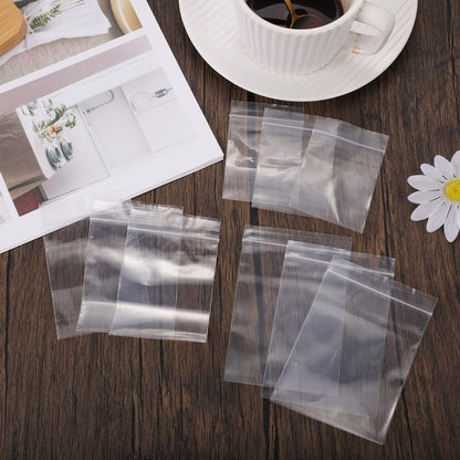 100 kleine Plastiktüten, 5 x 7 cm, wiederverschließbare Zip-Beutel, kleine durchsichtige Plastiktüten für Schmuck, Schrauben, Aufbewahrung